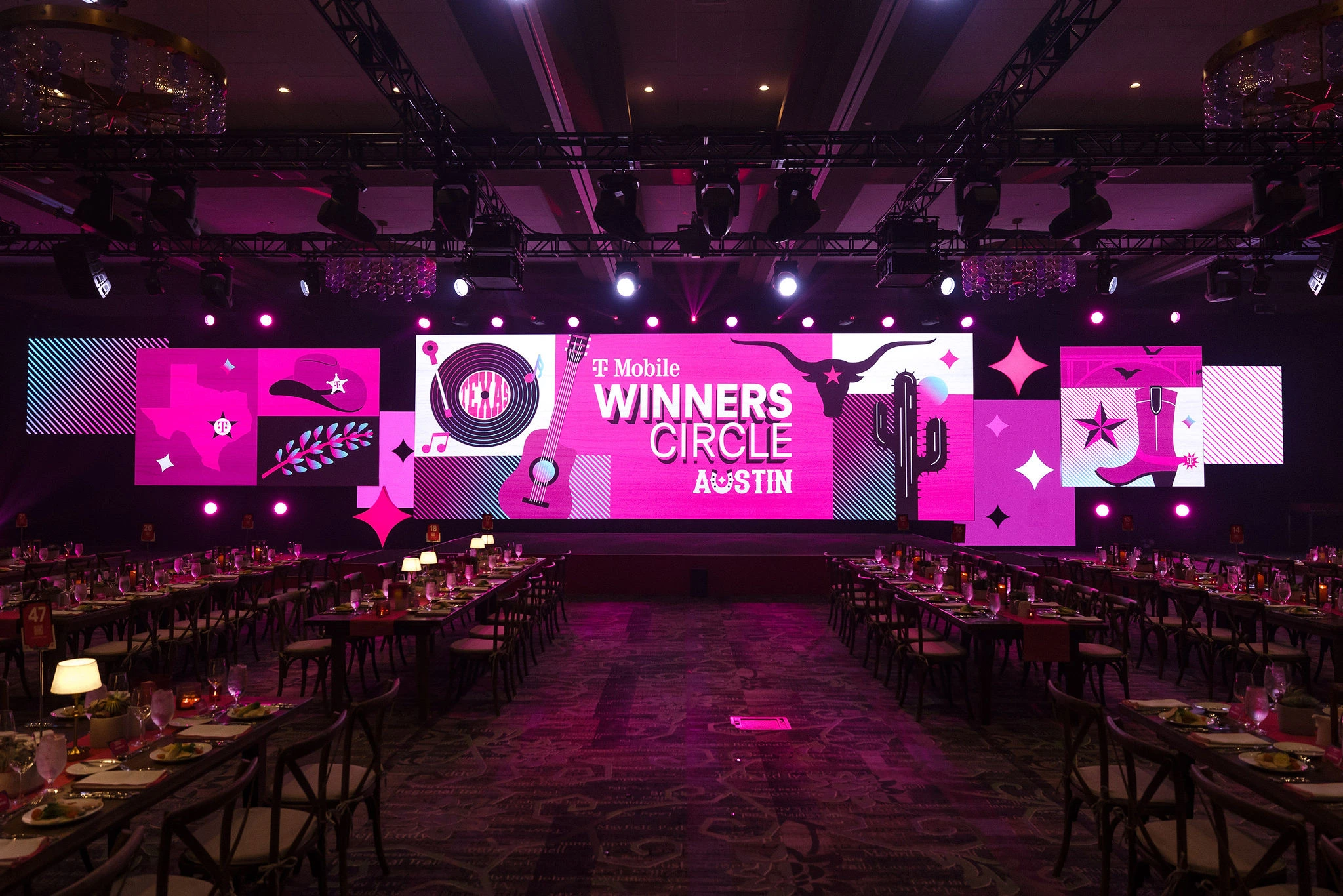 Texas-themed T-Mobile Winners Circle Austin stage overlooking long banquet tables