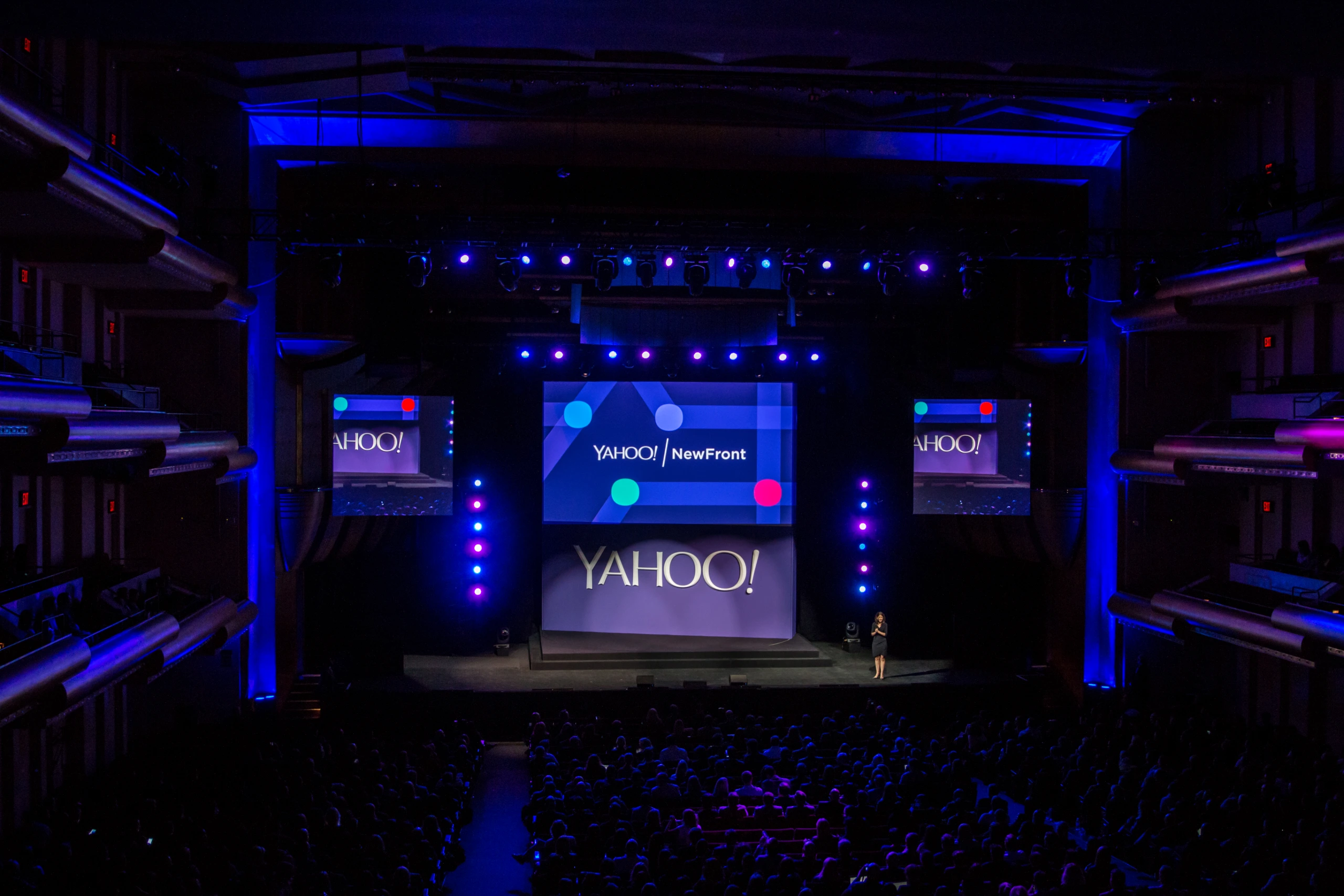 Yahoo NewFront keynote stage at Lincoln Center with glowing Yahoo screens and a full theater audience