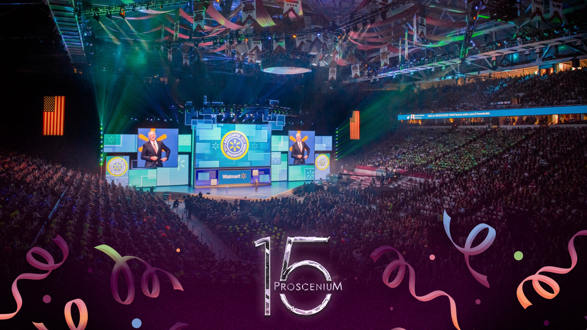 Walmart shareholders meeting filling an arena, speaker on giant screens above the stage, Proscenium 15 mark